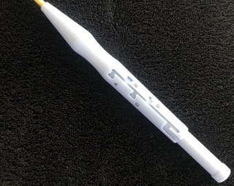 May include: White plastic tool with a gold needle tip and a sliding mechanism with four settings labeled A, B, C, and D.