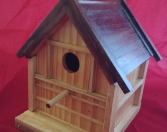 Classic wooden birdhouse for wrens and sparrows.