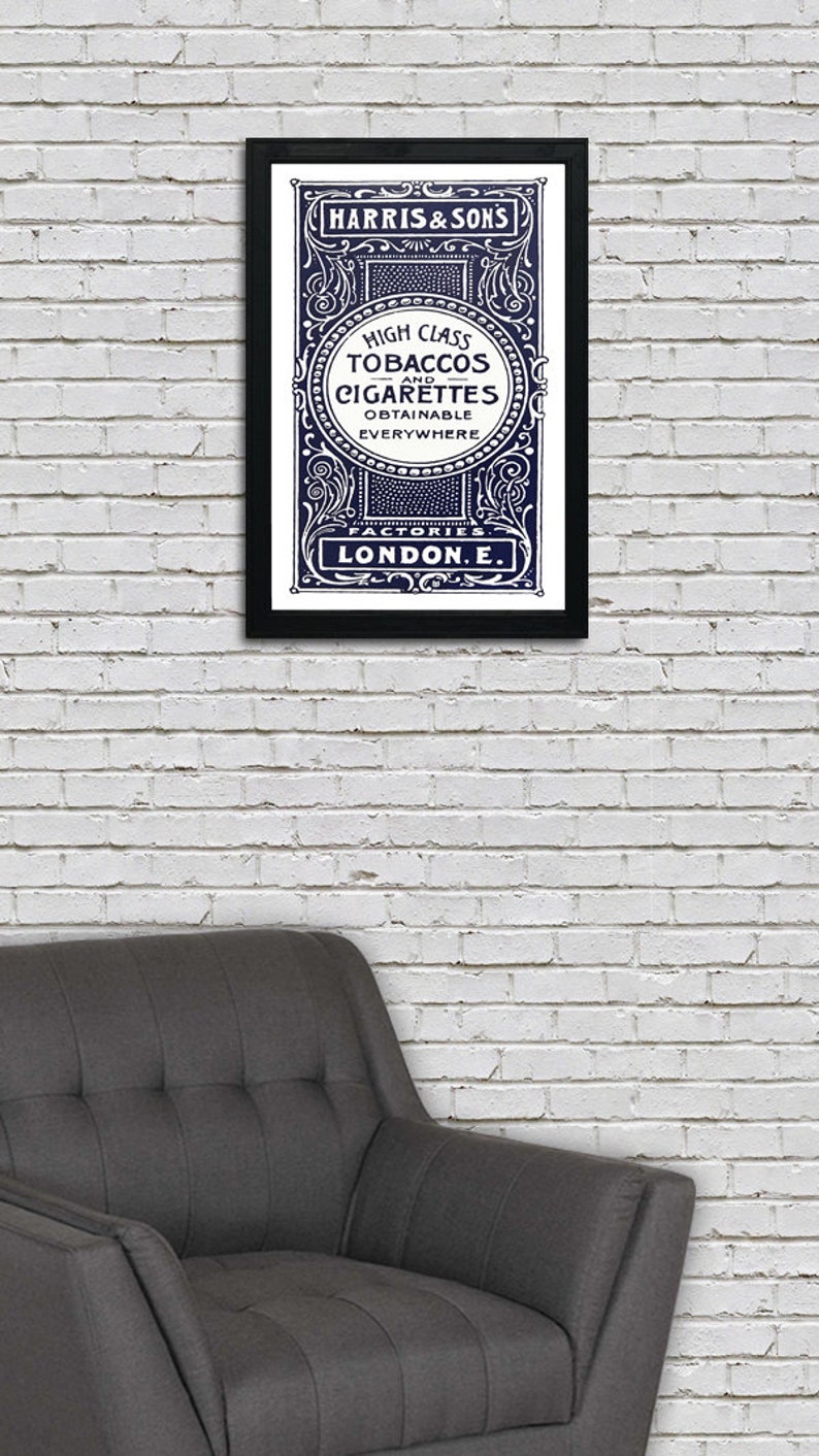 May include: A vintage advertisement for Harris & Sons high class tobaccos and cigarettes, featuring an ornate design with a navy blue background and white text. The text reads "High Class Tobaccos and Cigarettes Obtainable Everywhere Factories London E."