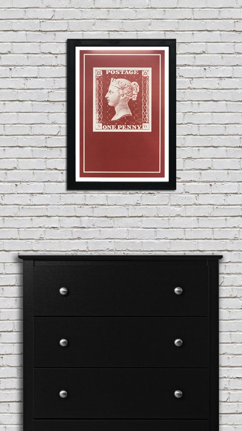 May include: A framed print of a vintage postage stamp featuring a portrait of Queen Victoria. The stamp is red with white lettering that reads "POSTAGE" and "ONE PENNY".
