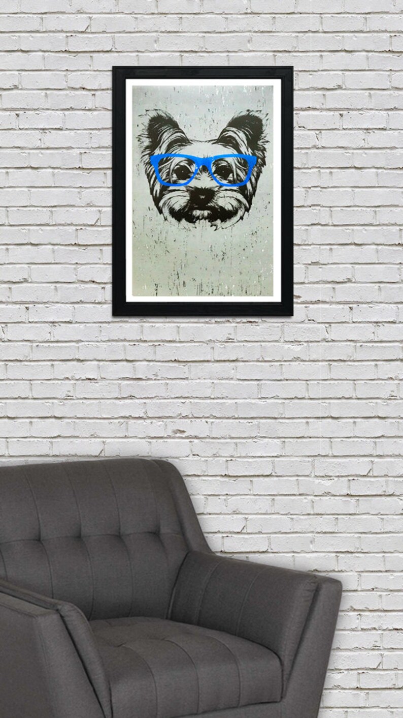 May include: A black and white illustration of a dog wearing blue glasses. The dog's face is the focus of the image, and the background is a light gray.