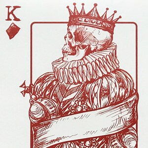 May include: Red and white playing card with a skull wearing a crown and a ruff. The card is a King of Diamonds.