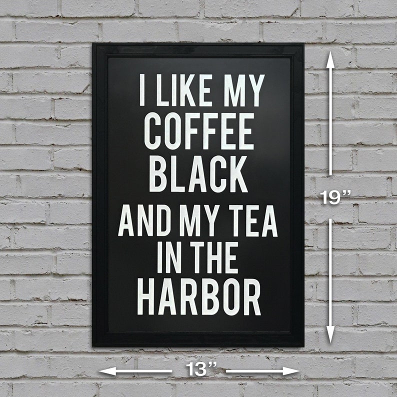 May include: Black and white sign with the text "I like my coffee black and my tea in the harbor" on a white brick wall. The sign is 13 inches wide and 19 inches tall.