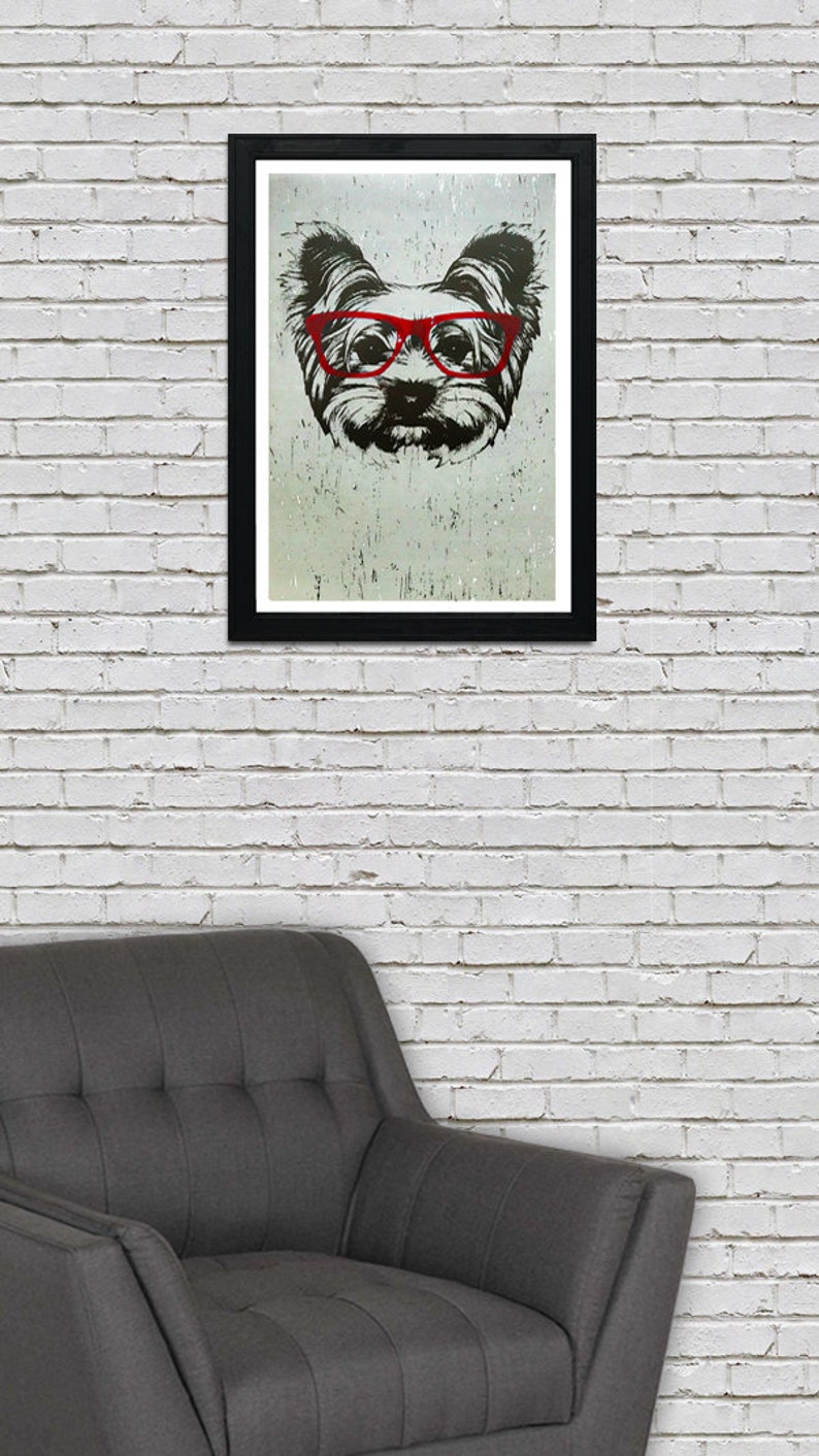 May include: A black and white illustration of a dog wearing red glasses. The dog's fur is fluffy and the background is a light gray color.