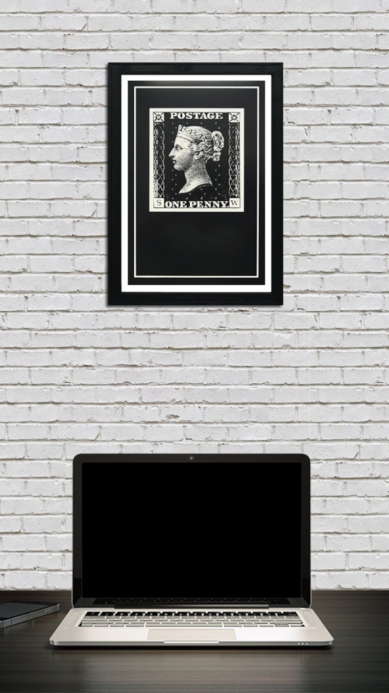 May include: A black and white framed print of a vintage postage stamp featuring a woman's profile and the text "POSTAGE ONE PENNY".