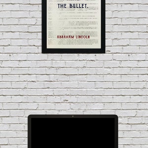 May include: A framed print with a white background and black text that reads "The Ballot is Stronger Than The Bullet." The text is in a vintage style font. The quote is attributed to Abraham Lincoln at the bottom of the print.