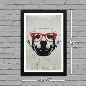 May include: A black and white illustration of a dog wearing red glasses. The image is printed on a white background with a distressed texture. The print is framed in a black frame with a white mount. The frame measures 13 inches wide by 19 inches tall.