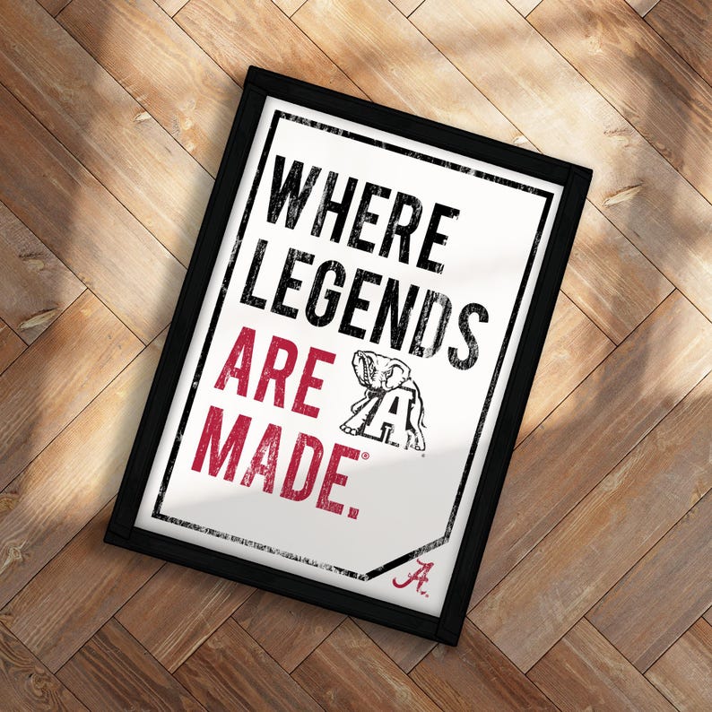 A framed poster with the text "WHERE LEGENDS ARE MADE" and an illustration of an elephant.
