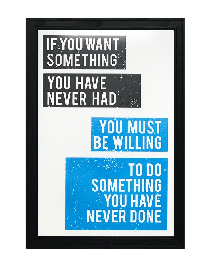May include: A motivational quote in a black frame on a white background. The quote reads: "If you want something you have never had, you must be willing to do something you have never done."