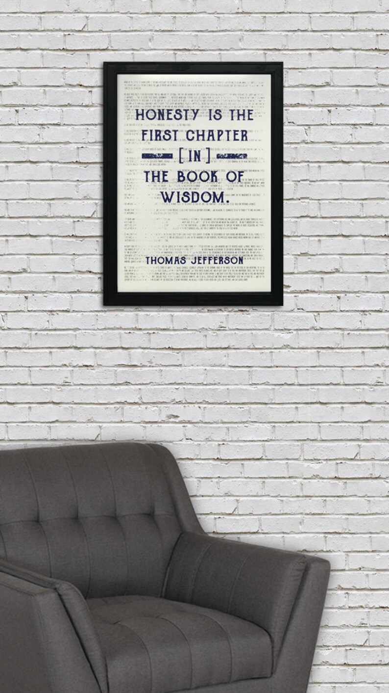 May include: A black framed print with a white background and blue text. The text reads "Honesty is the first chapter [in] the book of wisdom. Thomas Jefferson."