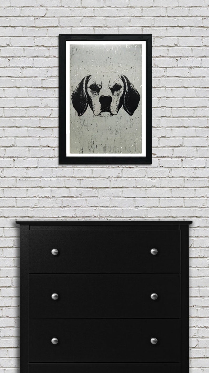 May include: Black and white illustration of a dog's head against a textured background. The dog has large floppy ears and a serious expression.