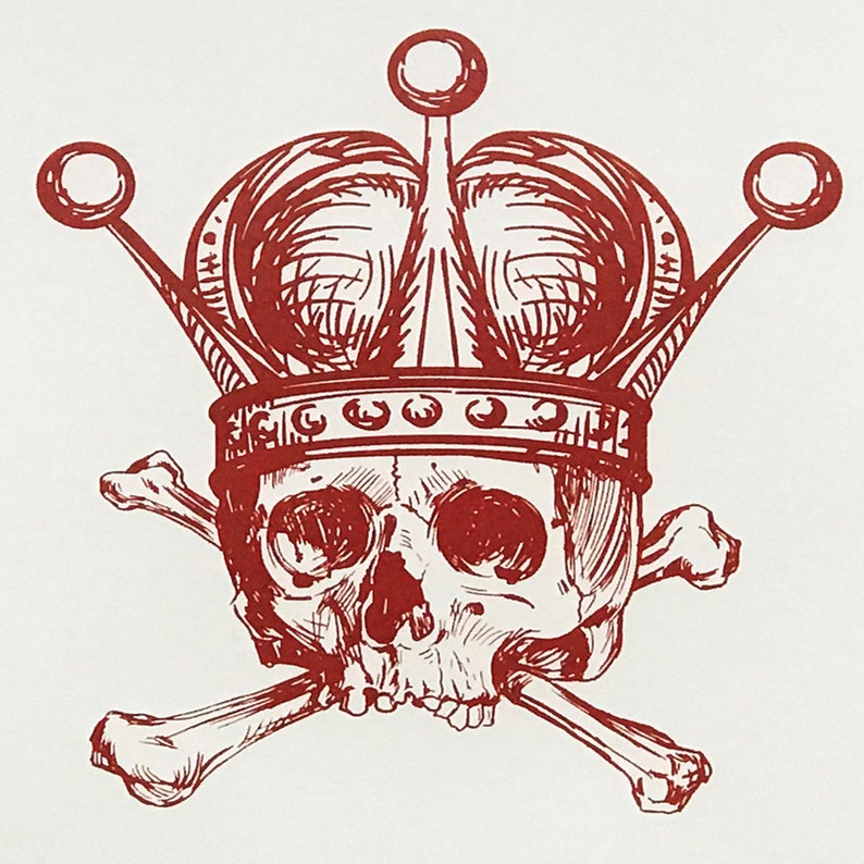 May include: A red and white illustration of a skull wearing a crown, with crossed bones beneath. The crown has three decorative spheres and a detailed design. The skull has visible eye sockets and a nose cavity.