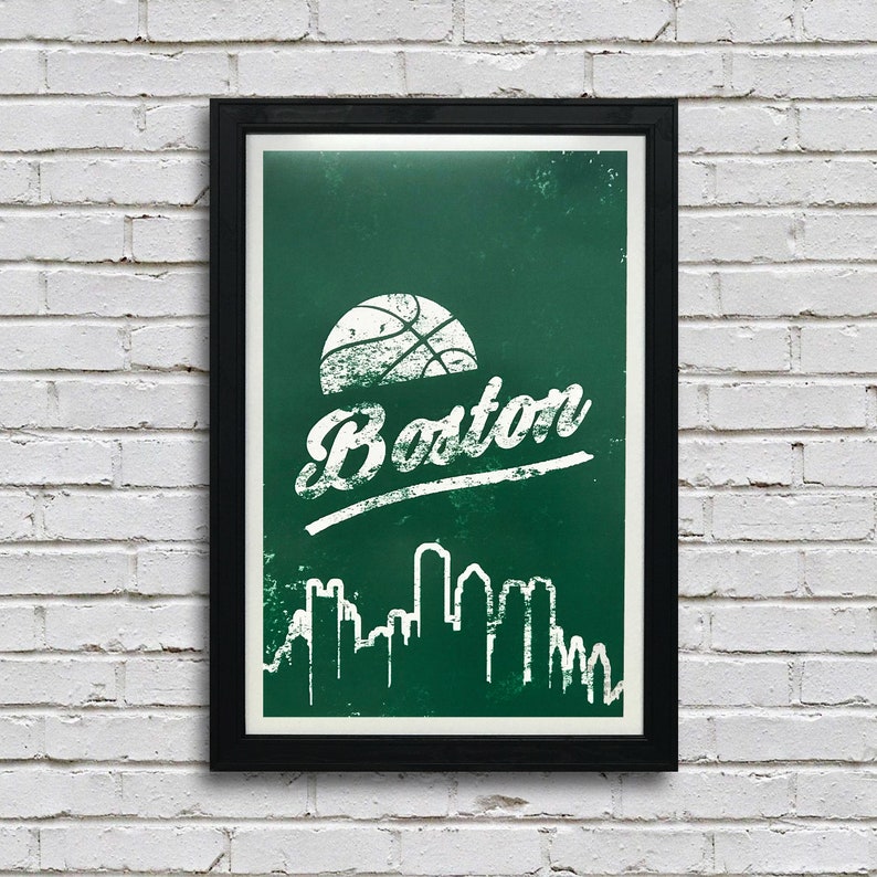 May include: A framed poster with a green background and a white basketball, the word "Boston" in a white distressed font, and a white silhouette of the Boston skyline.