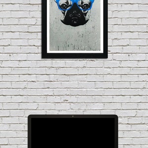 May include: A black and white illustration of a French bulldog wearing blue glasses. The illustration is framed in a black frame and hanging on a white brick wall. A laptop computer is sitting on a dark surface in front of the framed illustration.
