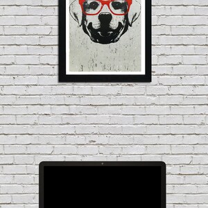 May include: A black and white illustration of a dog wearing red glasses. The dog is looking directly at the viewer. The illustration is framed in a black frame and hanging on a white brick wall.