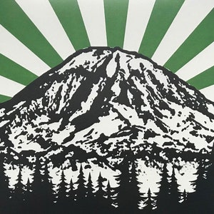 May include: A black and white illustration of a mountain with a green and white sunburst behind it. The mountain is covered in snow and has a forest of trees at the base.