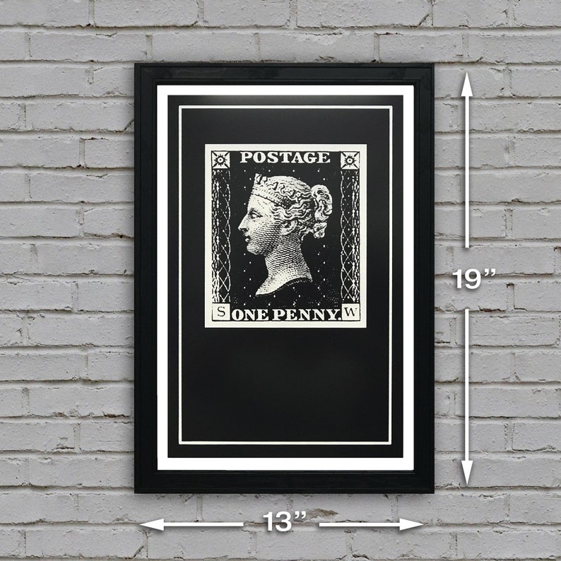 May include: A black and white framed print of a vintage postage stamp featuring a portrait of a woman with the text "POSTAGE ONE PENNY". The print measures 13 inches wide by 19 inches tall.