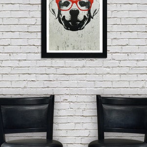 May include: A black and white illustration of a dog wearing red glasses. The illustration is framed in a black frame and hanging on a white brick wall. Two black bar stools are in the foreground.