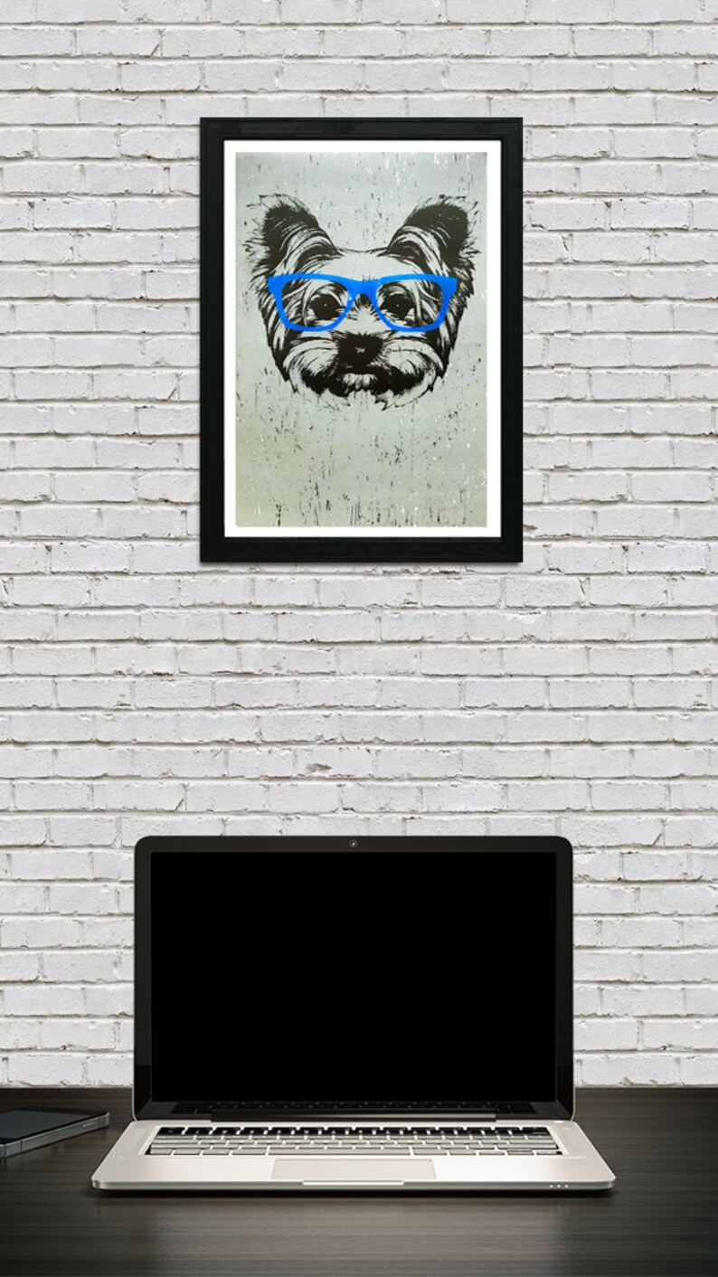 May include: A black and white illustration of a dog wearing blue glasses. The dog is looking directly at the viewer. The illustration is on a white background.