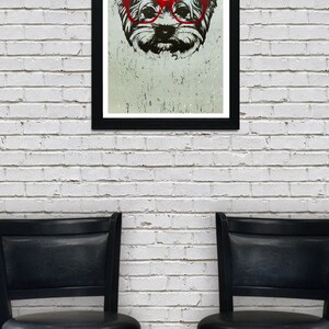 May include: A black and white illustration of a dog wearing red glasses. The dog is in a framed print, hanging on a white brick wall. Two black bar stools are in the foreground.