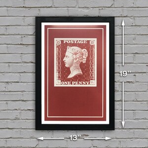 May include: A framed print of a vintage postage stamp featuring a red background and a white image of a woman's profile with the text "POSTAGE" and "ONE PENNY". The frame is black and measures 13 inches by 19 inches.