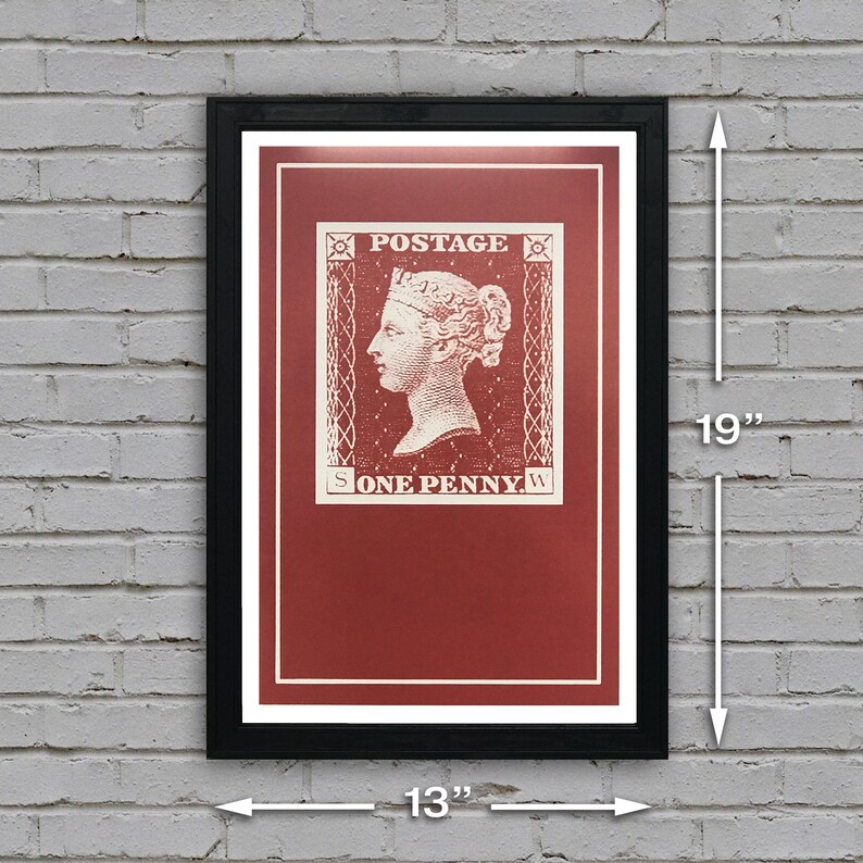 May include: A framed print of a vintage postage stamp featuring a red background and a white image of a woman's profile with the text "POSTAGE" and "ONE PENNY". The frame is black and measures 13 inches by 19 inches.