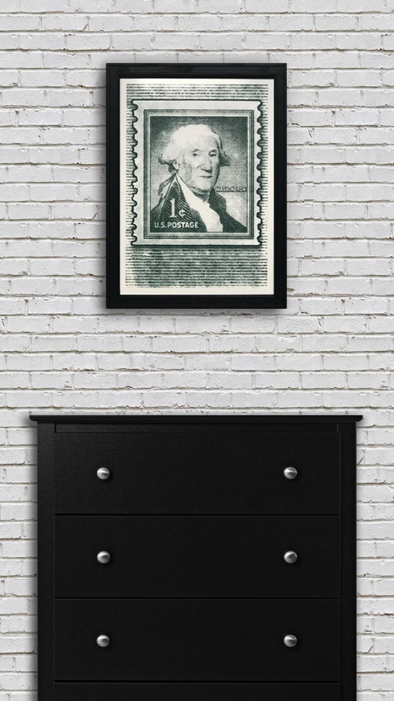 May include: A framed black and white print of a vintage US postage stamp featuring George Washington. The stamp is green and has the text "1&cent; U.S. POSTAGE" and "WASHINGTON" printed on it.