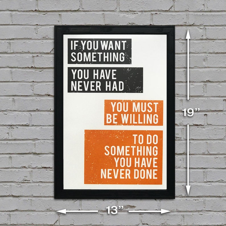 May include: A motivational poster with a black frame and white background. The text reads "If you want something you have never had, you must be willing to do something you have never done." The poster measures 13 inches wide by 19 inches tall.