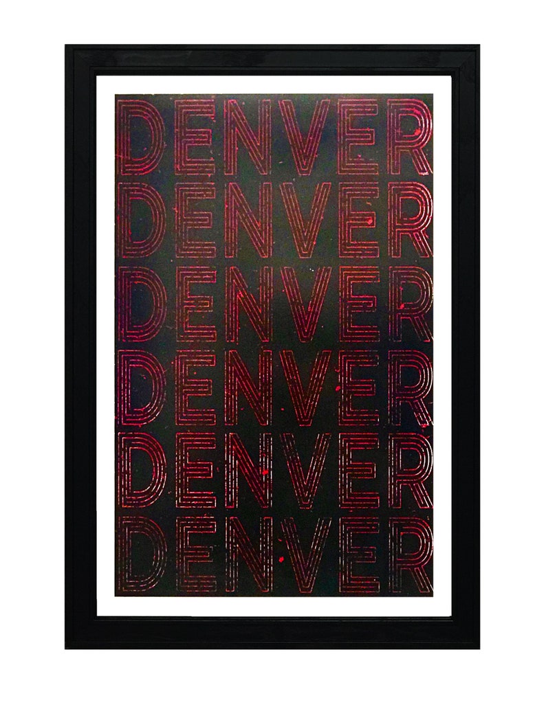 May include: A black framed print with the word "DENVER" repeated six times in a red, layered font on a black background.
