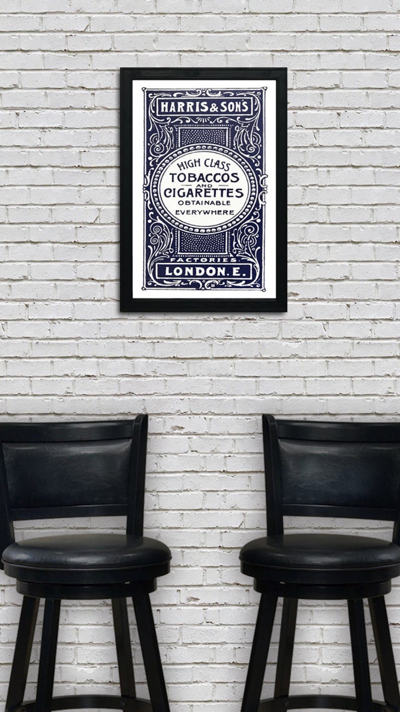 May include: A vintage advertisement for Harris & Sons high class tobaccos and cigarettes, printed in black and white with a blue background. The text reads "High Class Tobaccos and Cigarettes Obtainable Everywhere Factories London E."