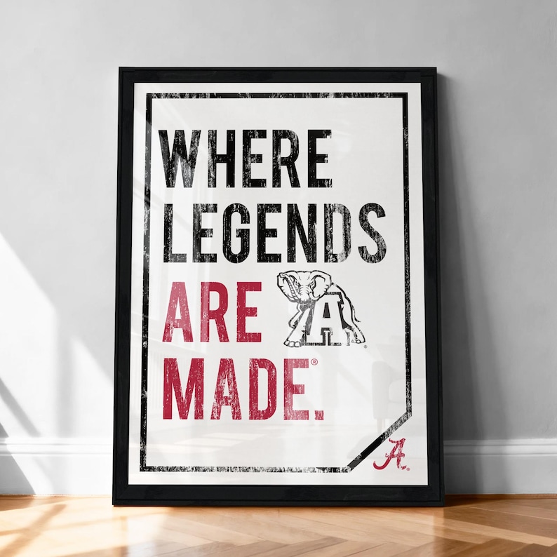 A framed poster with the text "WHERE LEGENDS ARE MADE." and an illustration of an elephant.