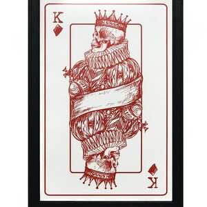 May include: A red and white playing card with a skull wearing a crown and a ruff. The card is the King of Diamonds.