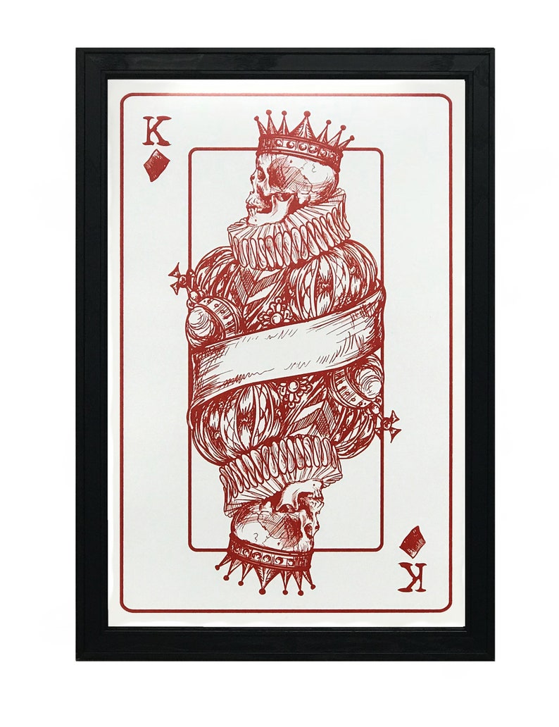 May include: A red and white playing card with a skull wearing a crown and a ruff. The card is the King of Diamonds.