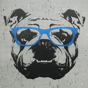 May include: A black and white illustration of a bulldog wearing blue-rimmed glasses. The bulldog's face is shown in close-up, with its mouth slightly open and its tongue visible.