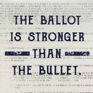 May include: A black and white image with a blue text overlay. The text reads "The Ballot is Stronger Than The Bullet."