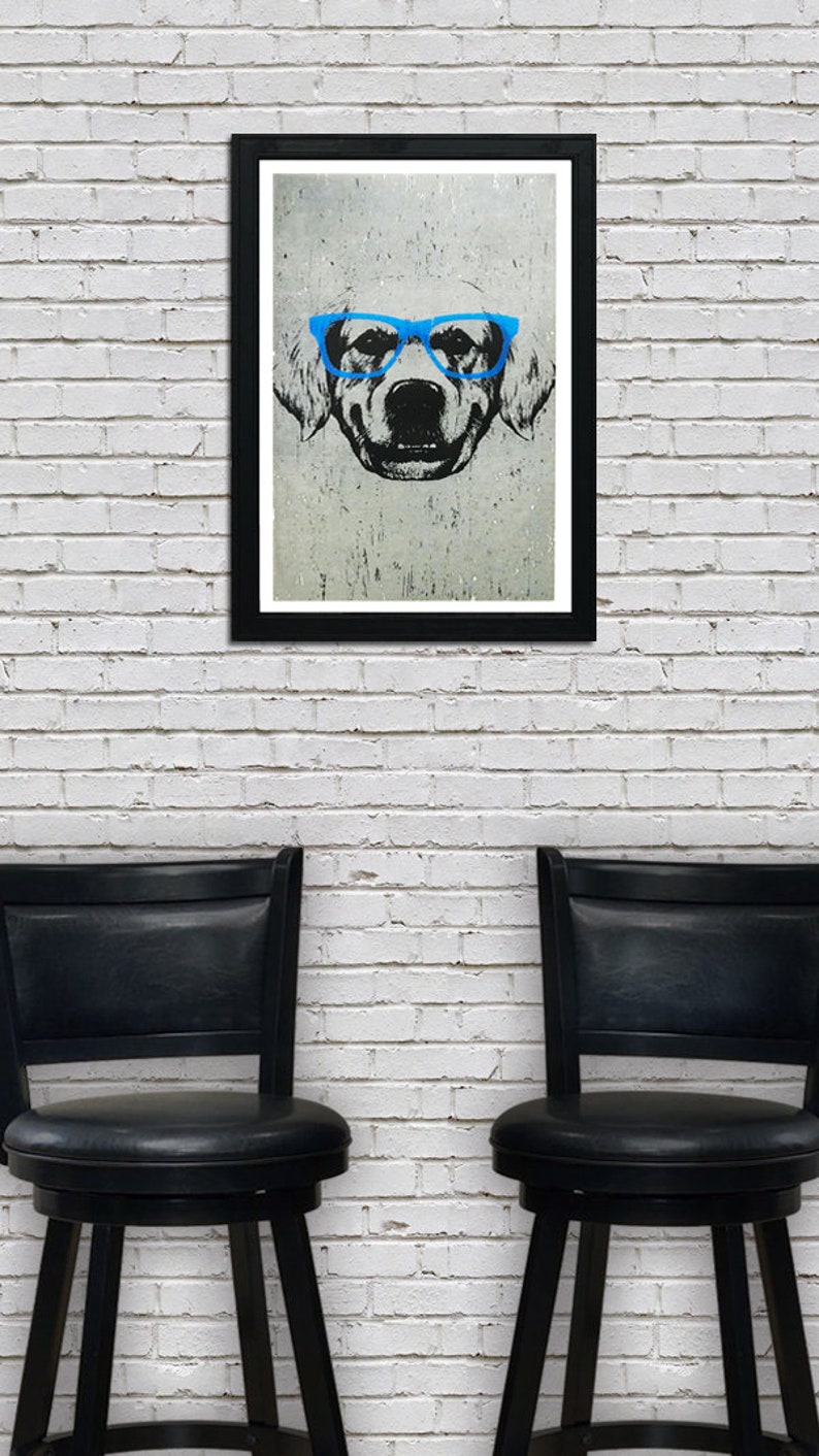 May include: A framed black and white illustration of a dog wearing blue glasses. The dog is looking directly at the viewer. The image is on a white brick wall with two black bar stools in front of it.