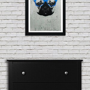 May include: A black and white illustration of a French bulldog wearing blue glasses. The image is printed on a textured background and framed in a black frame.