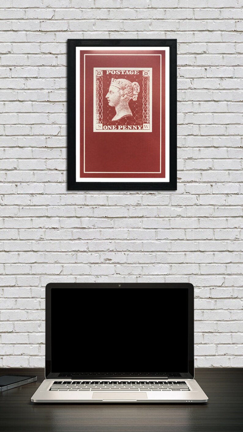 May include: A framed print of a vintage postage stamp featuring a portrait of Queen Victoria. The stamp is red with white lettering that reads "POSTAGE" and "ONE PENNY".
