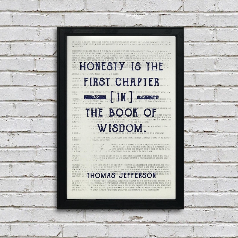 May include: A black framed print with a white background and blue text. The text reads "Honesty is the first chapter [in] the book of wisdom. Thomas Jefferson."