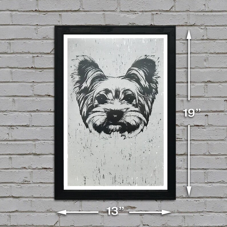 May include: Black and white illustration of a Yorkshire Terrier dog's face in a black frame. The frame is 13 inches wide and 19 inches tall.