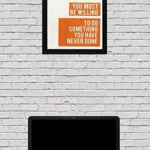 May include: A motivational poster with a black frame and white background. The text reads "If you want something you have never had you must be willing to do something you have never done."