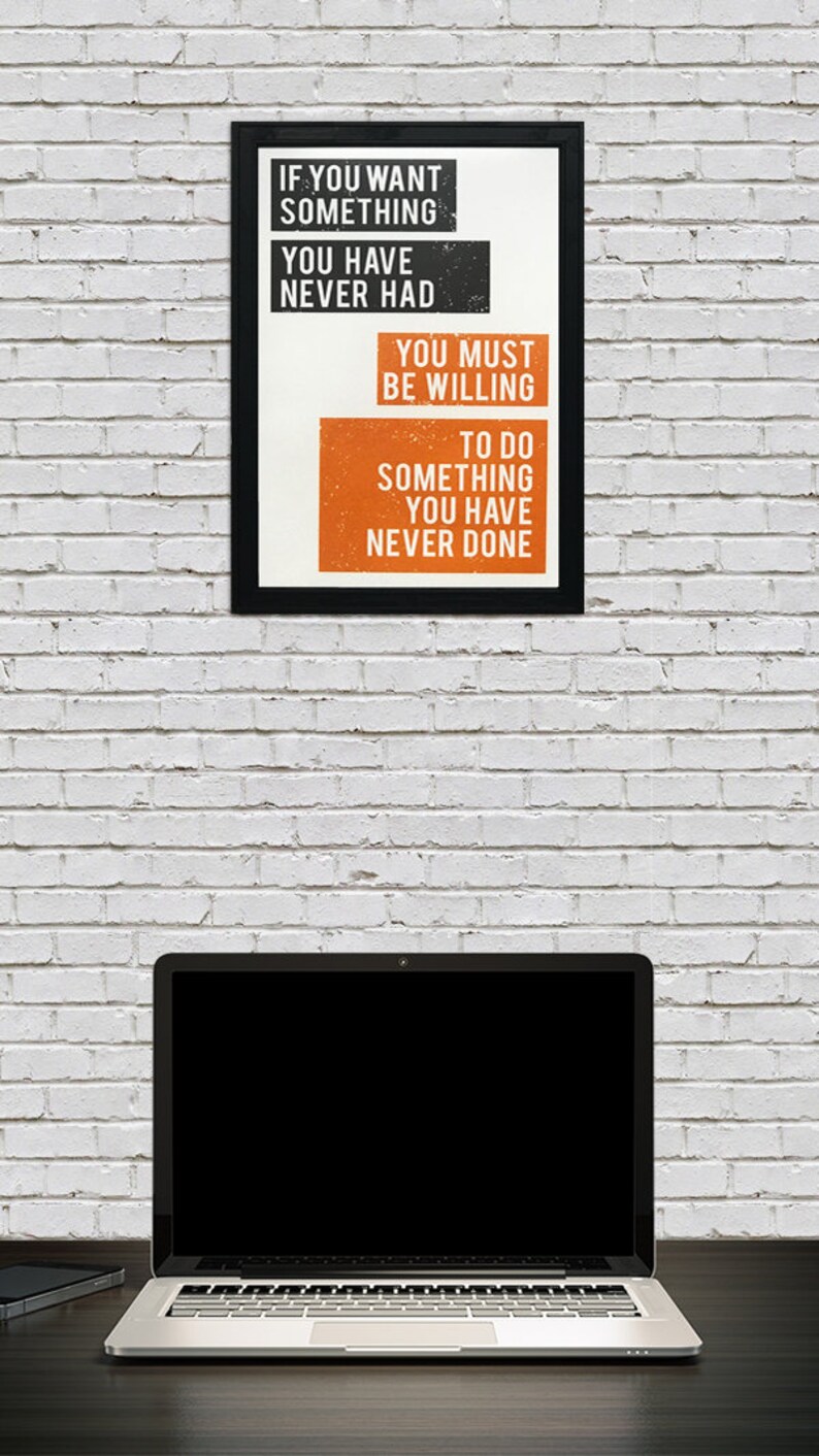 May include: A motivational poster with a black frame and white background. The text reads "If you want something you have never had you must be willing to do something you have never done."