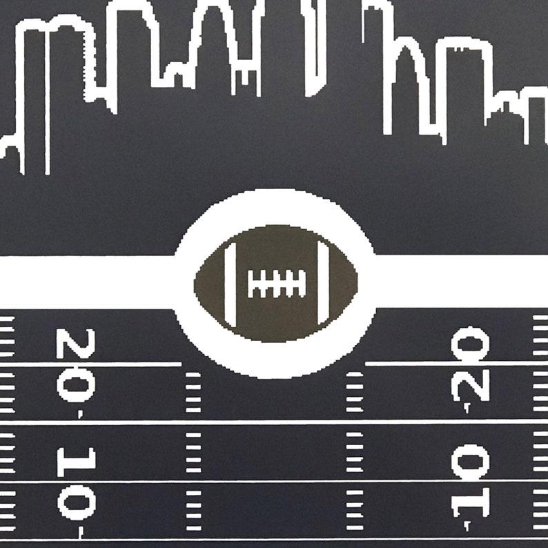 May include: A black and white illustration of a city skyline with a football in a white circle on a black and white football field. The field has yard lines marked with the numbers 10 and 20.