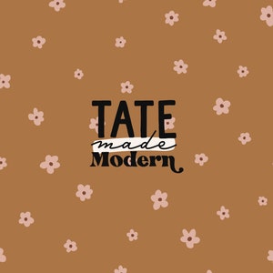 May include: A brown background with a scattered pattern of pink flowers. The text "TATE made Modern" is in black lettering.