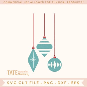 May include: Three teal blue Christmas ornaments with white geometric designs hanging from red strings. The ornaments are in the shape of a teardrop, a sphere, and a diamond.