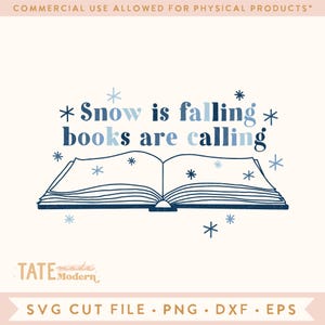 May include: A digital design featuring an open book illustration with the text "Snow is falling books are calling" in blue and navy. Snowflakes surround the book on a cream background. The design includes the text "SVG CUT FILE • PNG • DXF • EPS".