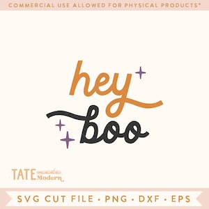 May include: A digital design file for a Halloween-themed SVG cut file. The design features the text "hey boo" in a black and orange script font with purple stars.