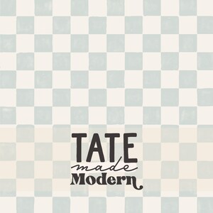 May include: A checkered pattern in light blue and cream colors. The text "TATE made Modern" is displayed in a bold, black font with a handwritten "made" in the center. The overall design has a modern aesthetic.