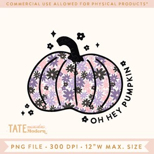 May include: A pink and purple floral pumpkin with a black outline and the text "Oh Hey Pumpkin" in a black circle around it.