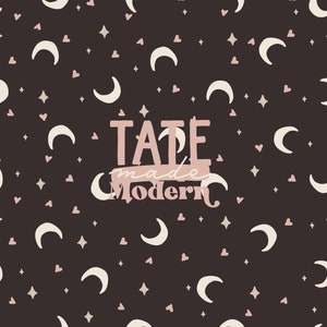 May include: A seamless pattern with white crescent moons, pink hearts, and gold stars on a dark brown background. The text "TATE made Modern" is in the center of the pattern in pink.
